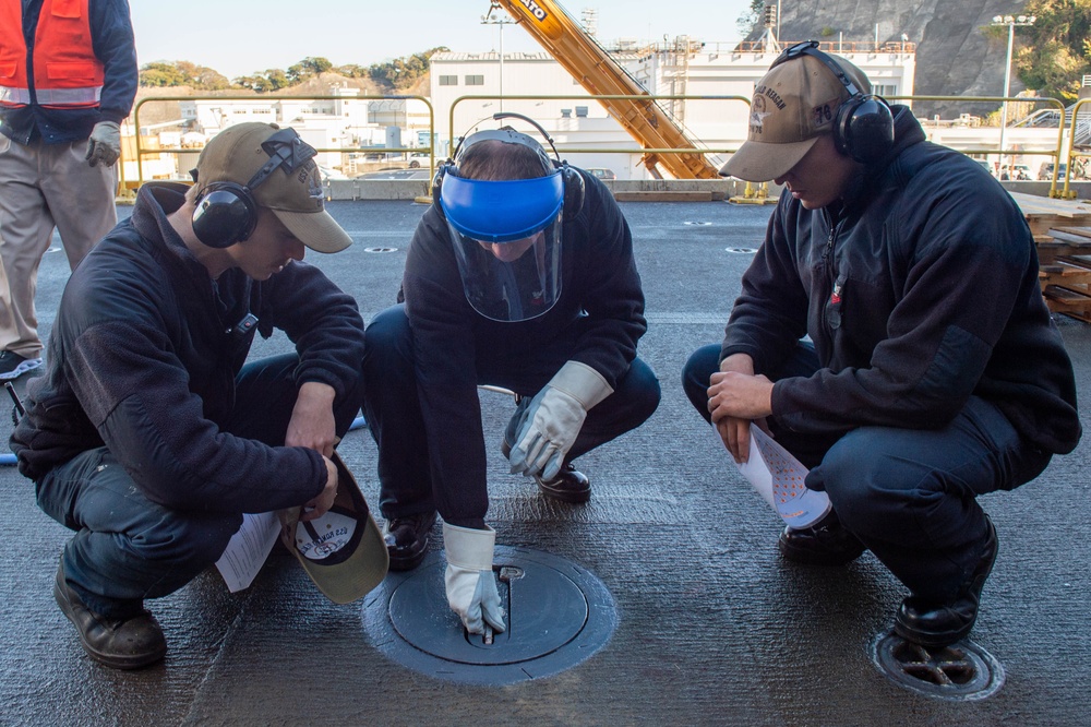 USS Ronald Reagan (CVN 76) Sailors perform planned maintenance and spot checks