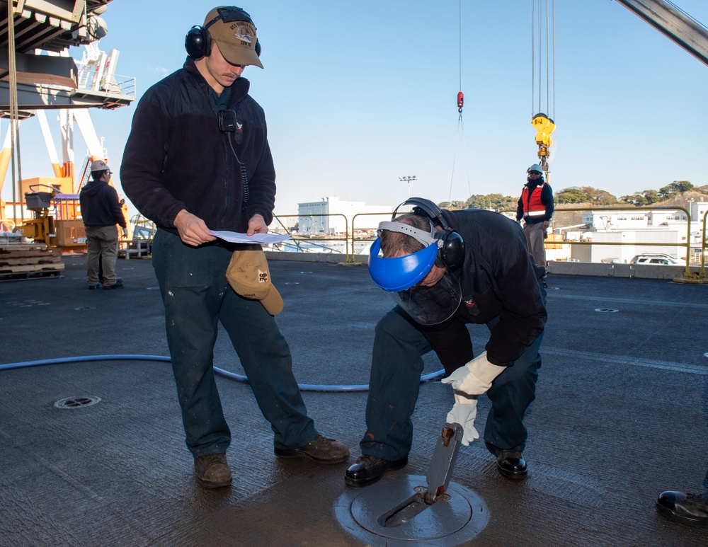 USS Ronald Reagan (CVN 76) Sailors perform planned maintenance and spot checks