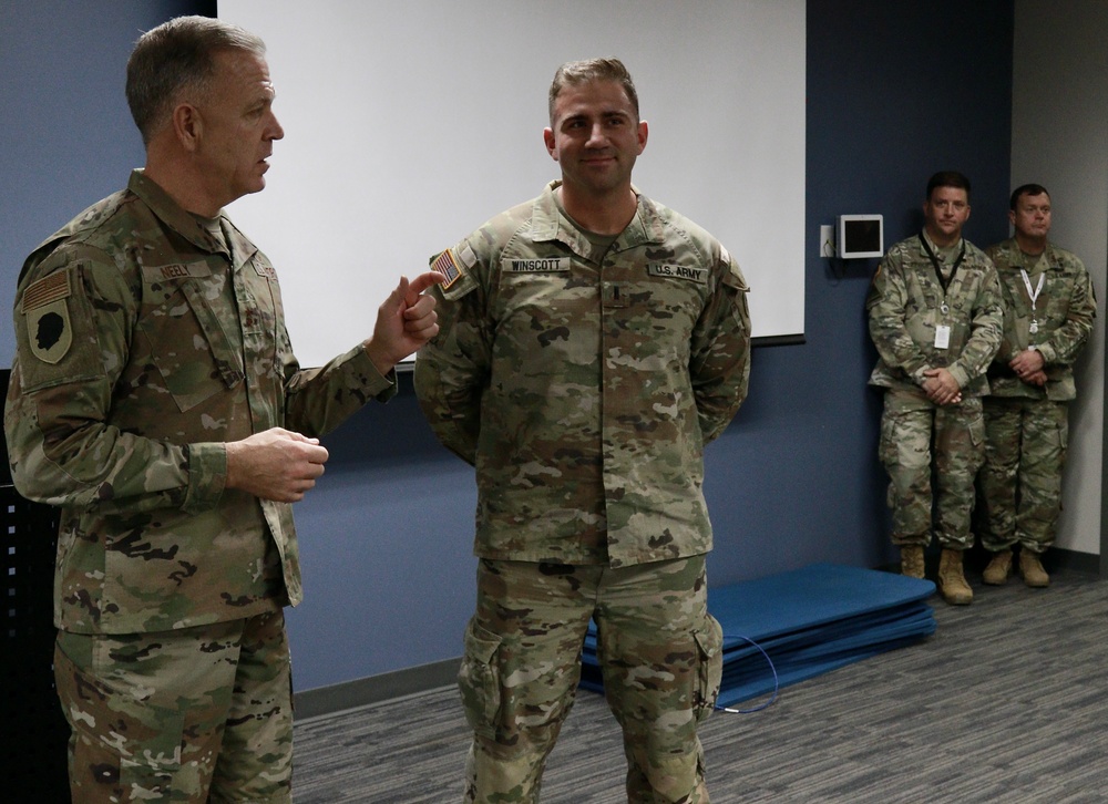 Adjutant General of Illinois 'Coins' Two National Guard Officers at Leader Engagement