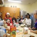 Soldiers bake cookies with Polish Neighbors