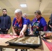 Soldiers bake cookies with Polish Neighbors