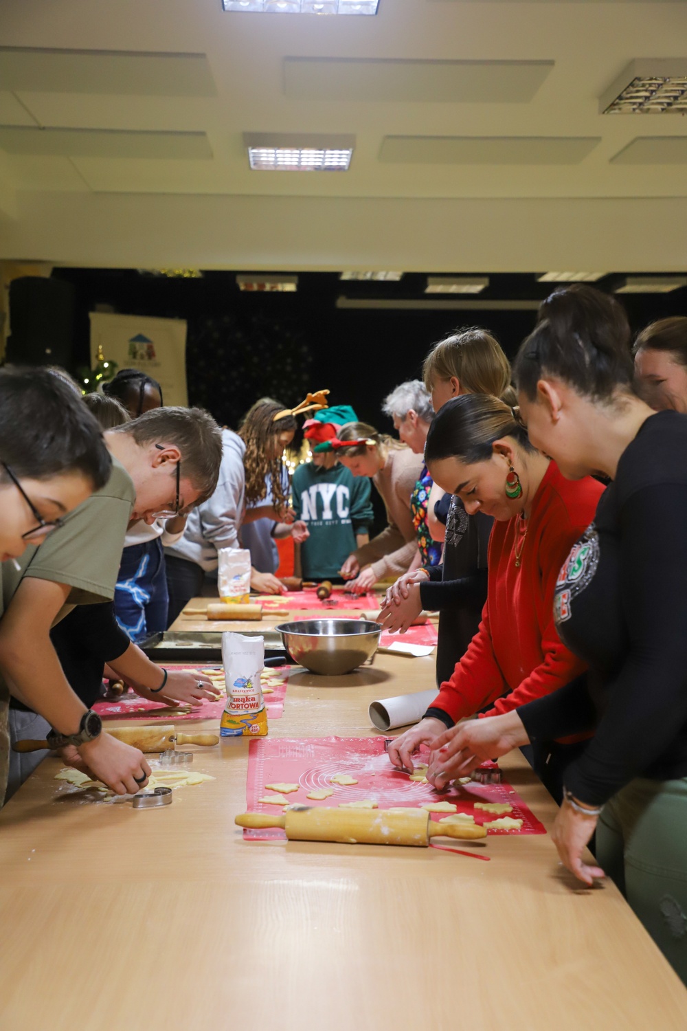 Soldiers bake cookies with Polish Neighbors