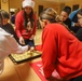 Soldiers bake cookies with Polish Neighbors
