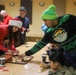 Soldiers bake cookies with Polish Neighbors