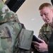 Siblings sharing in service: DC Air National Guard brothers inspect an F-16