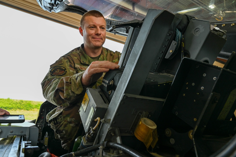 Siblings sharing in service: DC Air National Guard brothers inspect an F-16