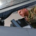 Siblings sharing in service: DC Air National Guard brothers inspect an F-16