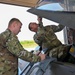 Siblings sharing in service: DC Air National Guard brothers inspect an F-16