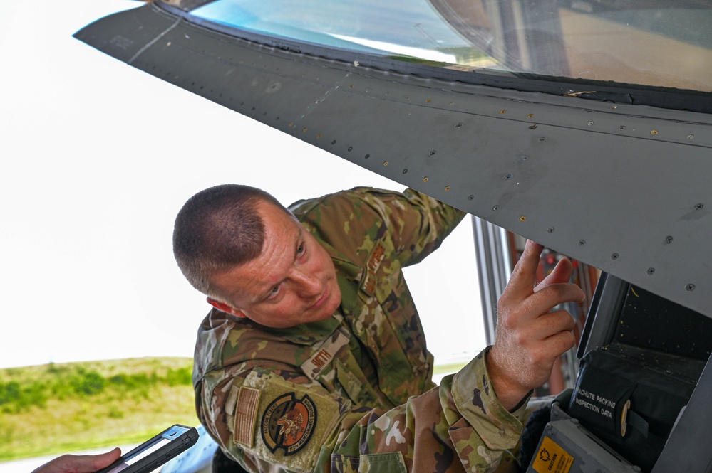 Siblings sharing in service: DC Air National Guard brothers inspect an F-16