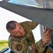 Siblings sharing in service: DC Air National Guard brothers inspect an F-16