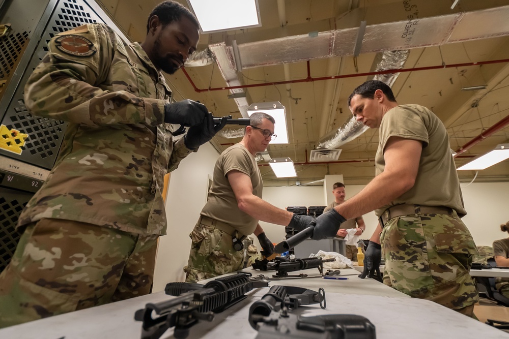 920th Airmen clean weapons