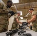 920th Airmen clean weapons