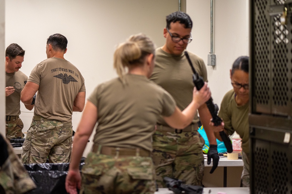 920th Airmen clean weapons