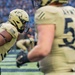 Player from the U.S. Military Academy prepares for the 124th Army Navy football game