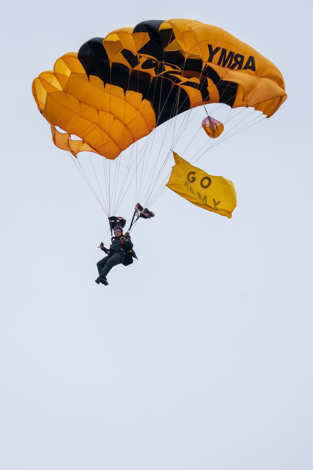 Soldiers from Army Golden Knights jump into Gillette Stadium for the 124th Army Navy football game