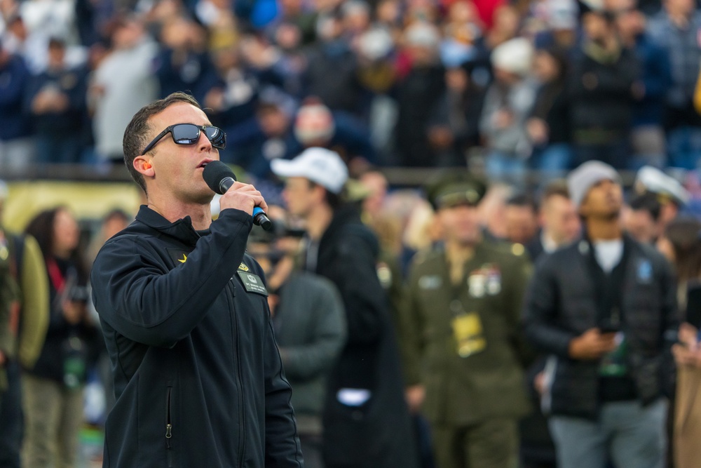 Soldiers from Army Golden Knights jump into Gillette Stadium for the 124th Army Navy football game