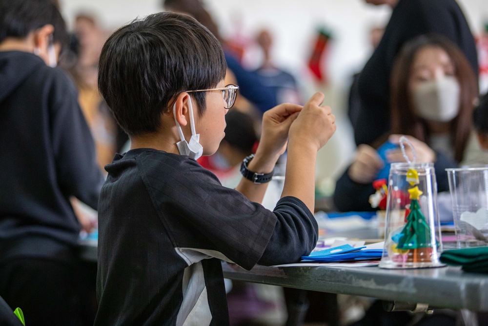 Spreading Holiday Cheer: Marine Corps Air Station Iwakuni Chapel hosts a community relations event inviting Local Orphanage