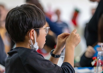 Spreading Holiday Cheer: Marine Corps Air Station Iwakuni Chapel hosts a community relations event inviting Local Orphanage