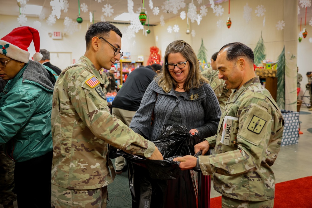 Lt. Gen. Retired Arthur Gregg among cherished guests at Holiday Helper Open House