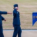 Newly commissioned Air Force lieutenants march by for pass and review