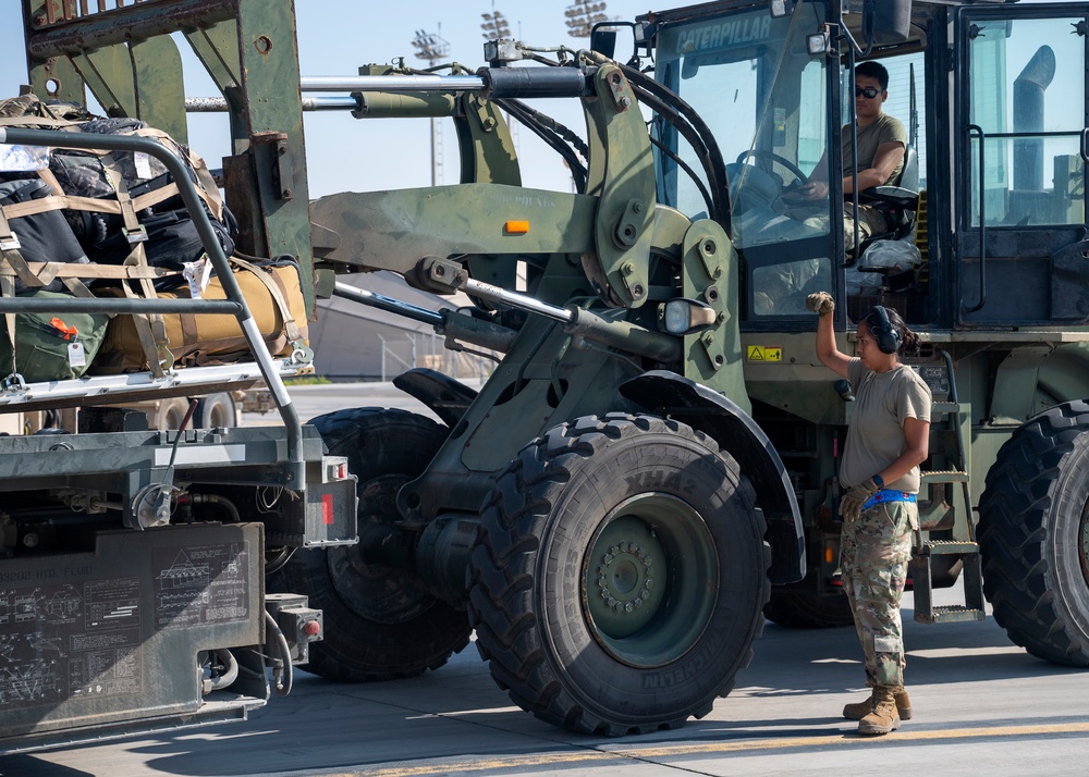 Logistics Airmen load cargo for ACE