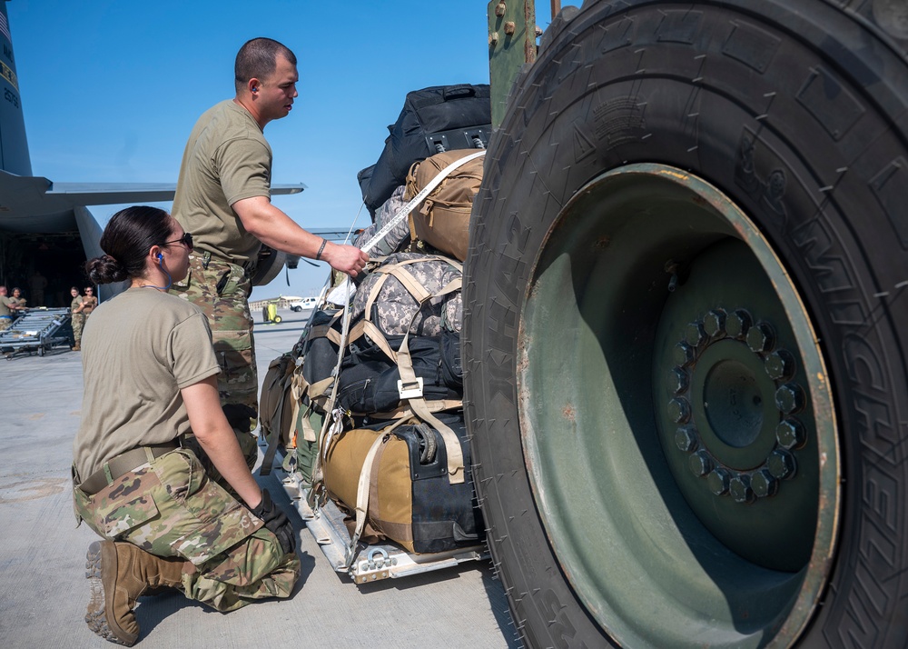 Logistics Airmen load cargo for ACE