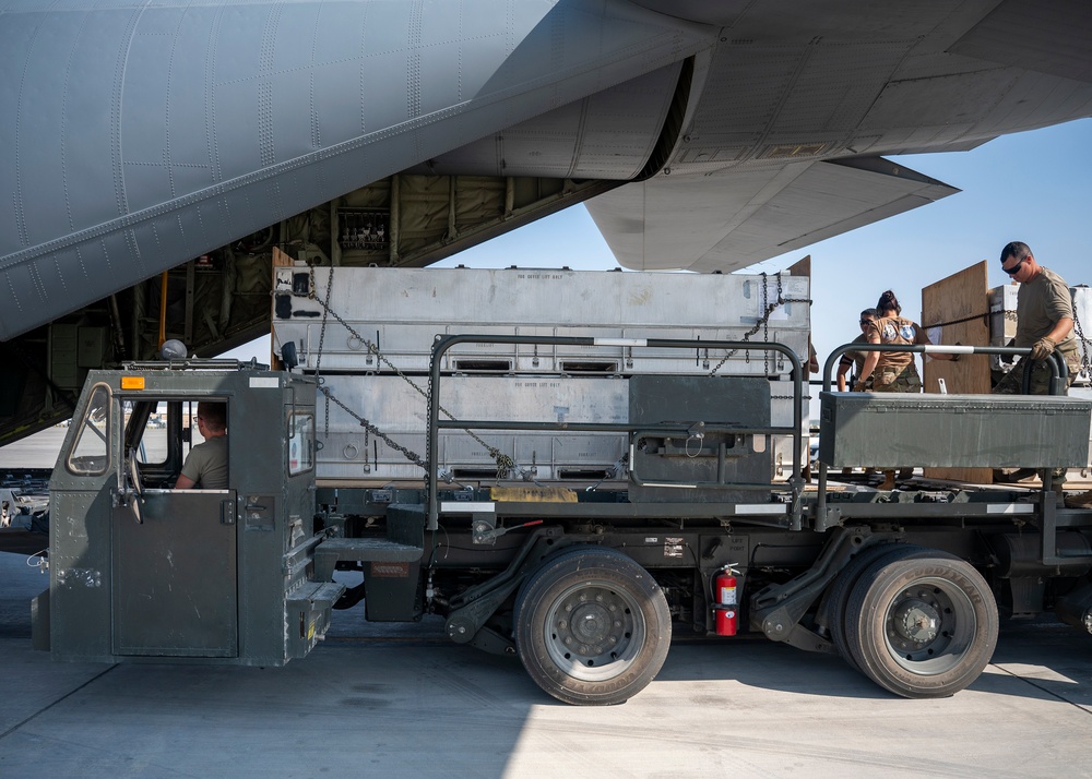 Logistics Airmen load cargo for ACE