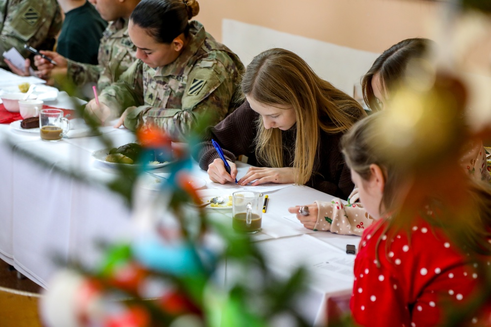 Sustainment Soldiers Visit Powidz School for Holiday Party