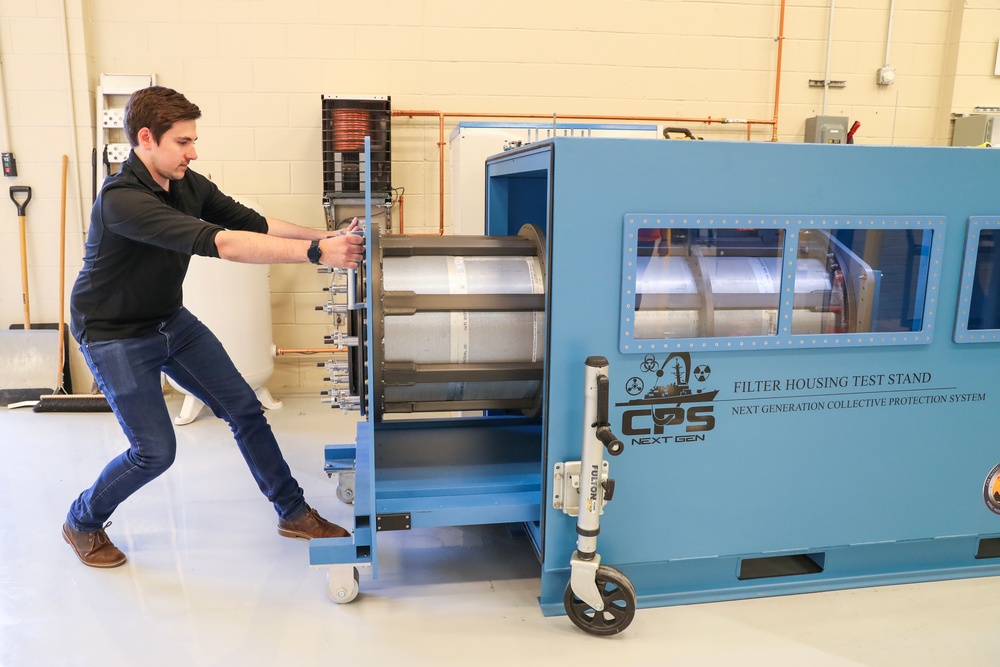 NSWC IHD CBRD engineer prepares filter housing test stand for testing