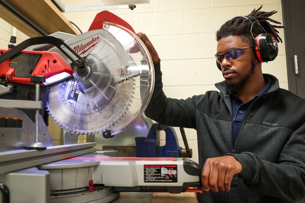 NSWC IHD CBRD engineer cuts material for test fixture