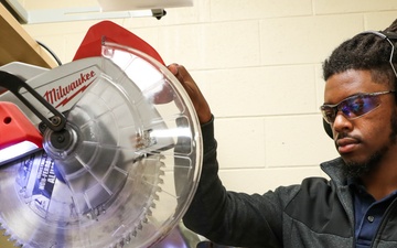 NSWC IHD CBRD engineer cuts material for test fixture