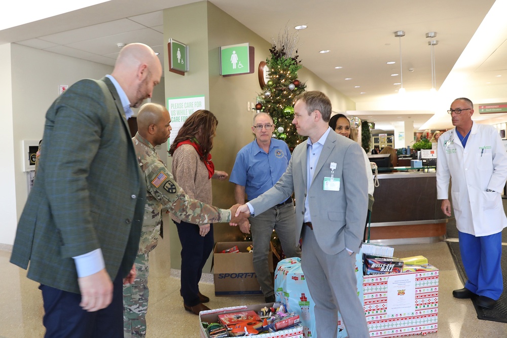 Army Reserve Soldiers participate in a toy drive for children at local hospital pediatric unit