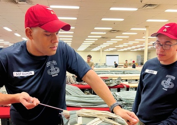 Parachute Riggers prepare for Operation Toy Drop