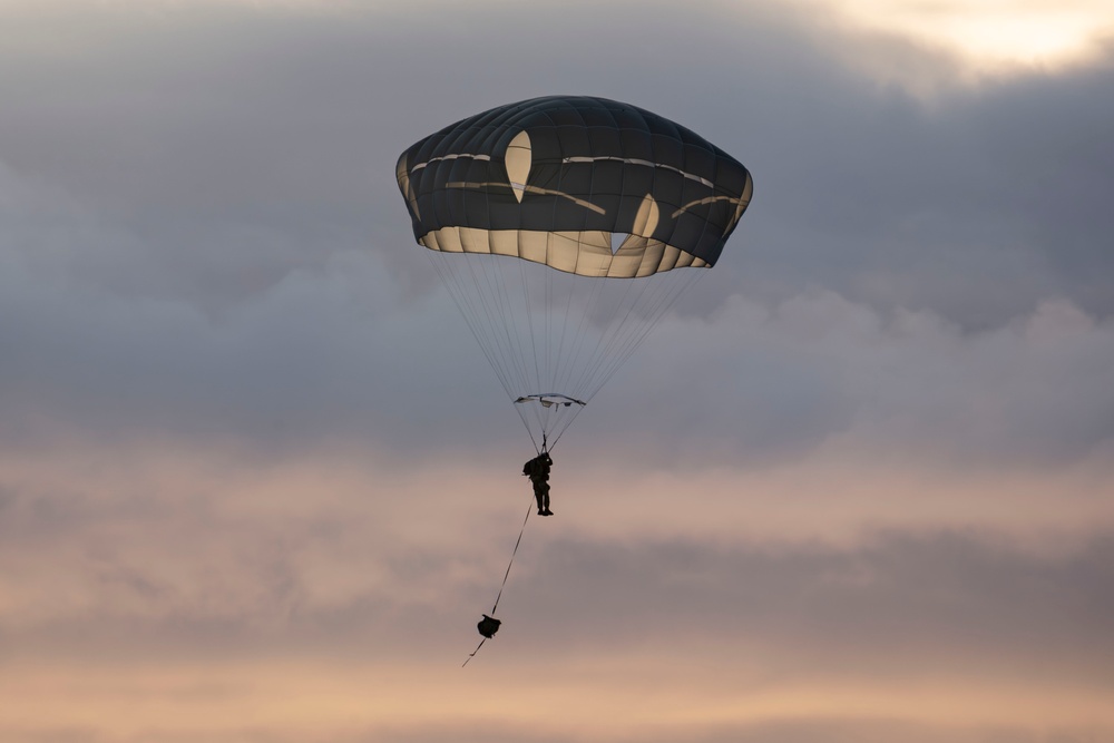 Army paratroopers and Marine Corps aviators conduct joint airborne training at JBER