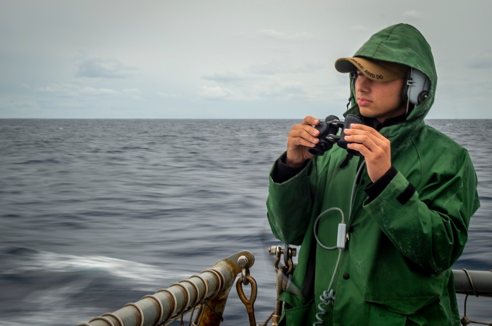 USS Hopper (DDG 70) Sailor Stands Lookout Watch