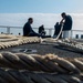 USS Hopper (DDG 70) Sailors Repair Mooring Lines