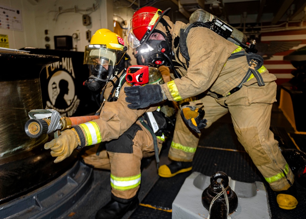 USS Ronald Reagan (CVN 76) conducts a joint damage control drill