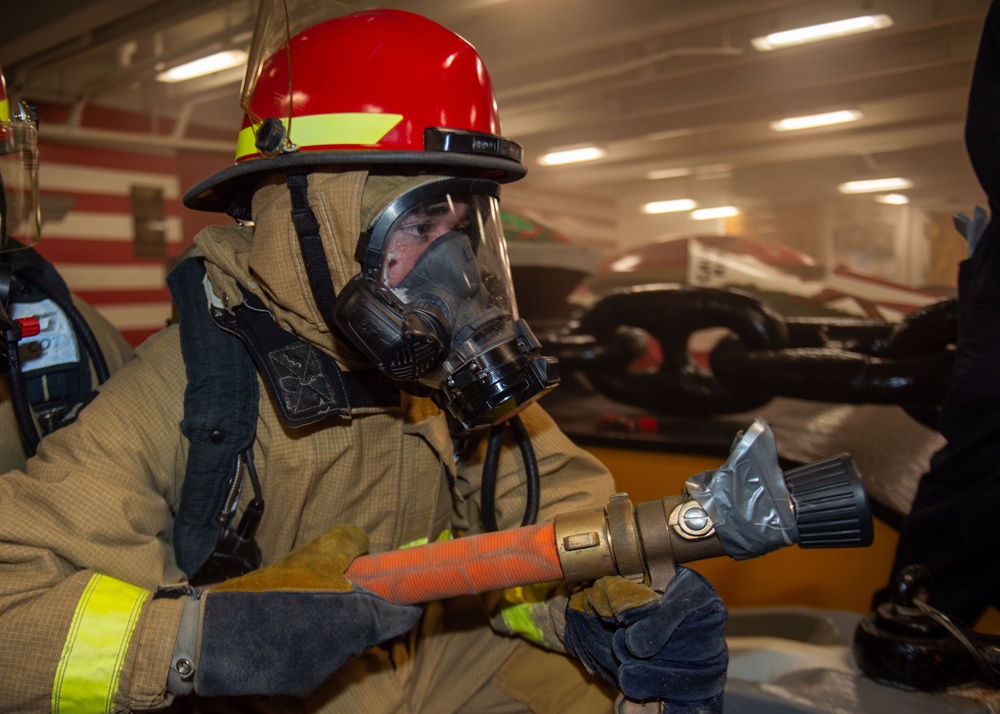 USS Ronald Reagan (CVN 76) conducts a joint damage control drill