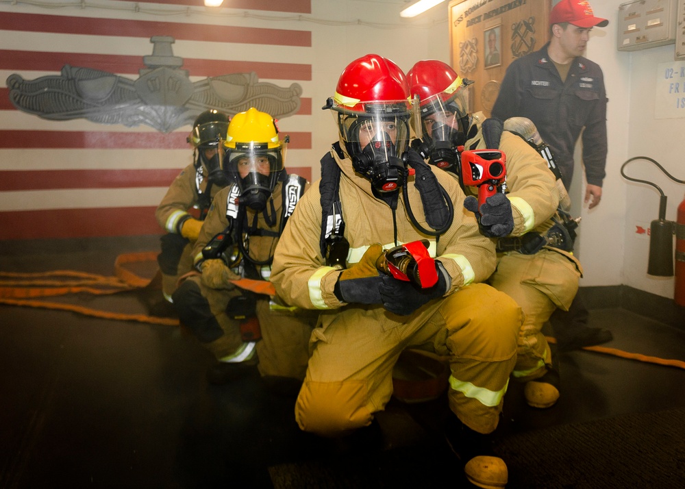 USS Ronald Reagan (CVN 76) conducts a joint damage control drill