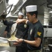 Sailor Prepares Food in the Galley