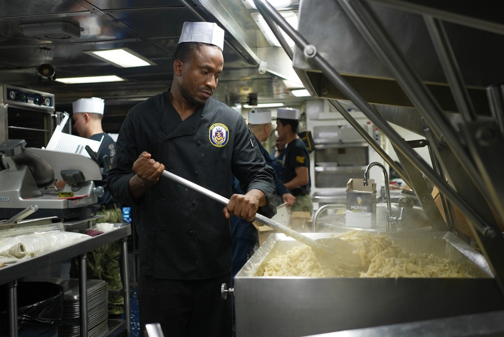 Sailor Prepares Food in the Galley