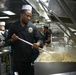 Sailor Prepares Food in the Galley