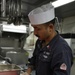 Sailor Prepares Food in the Galley