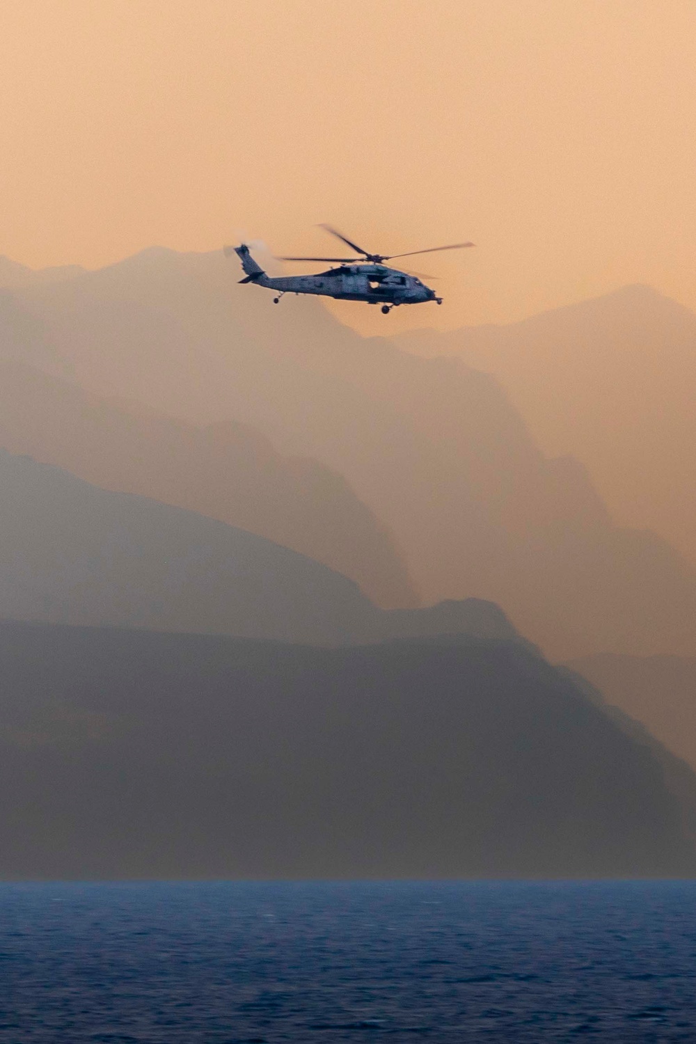 MH-60 Helicopter flies over Mountains in Strait of Hormuz