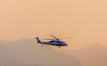 MH-60 Helicopter flies over Mountains in Strait of Hormuz