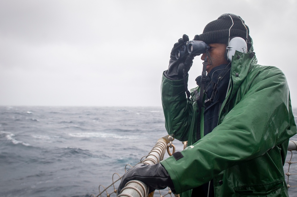 USS Hopper (DDG 70) Sailor Stands Lookout Watch