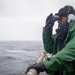 USS Hopper (DDG 70) Sailor Stands Lookout Watch