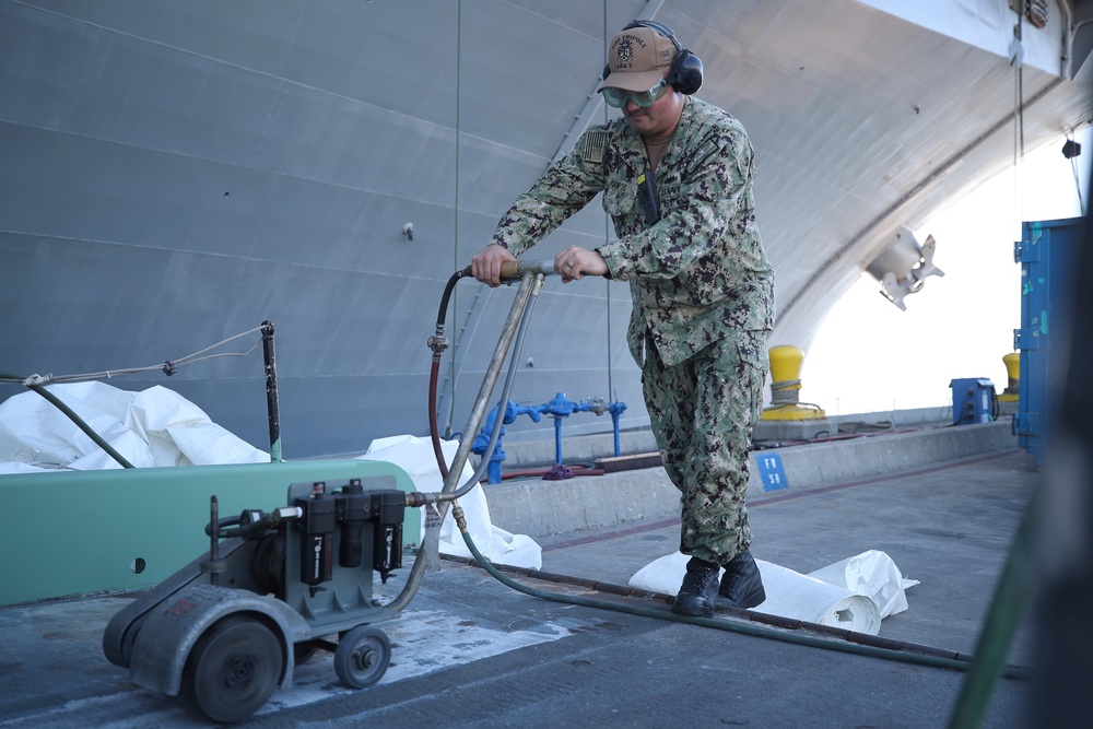 USS Tripoli Sailor Powers Up the Deck-Crawler