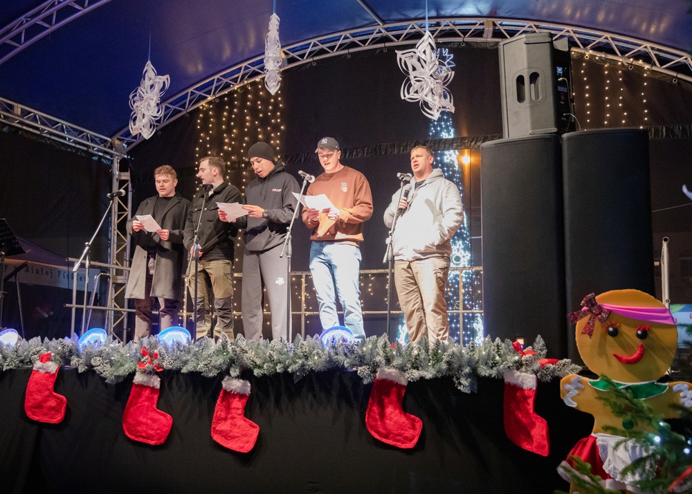 Dogface Soldiers serenade Biała Piska, Poland, with Christmas carols