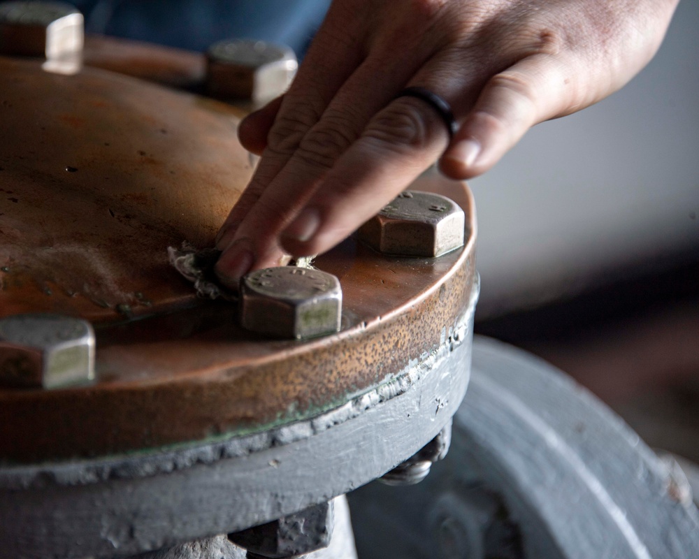 Sailor Shines Brass Aboard USS Carl Vinson (CVN 70)